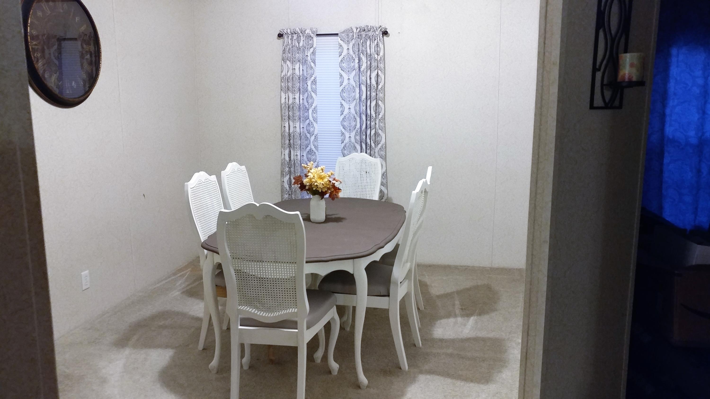 319 Delaware Road DeFuniak Springs, FL 32433 - Photo 2 of 22 a dining room with furniture and a mirror