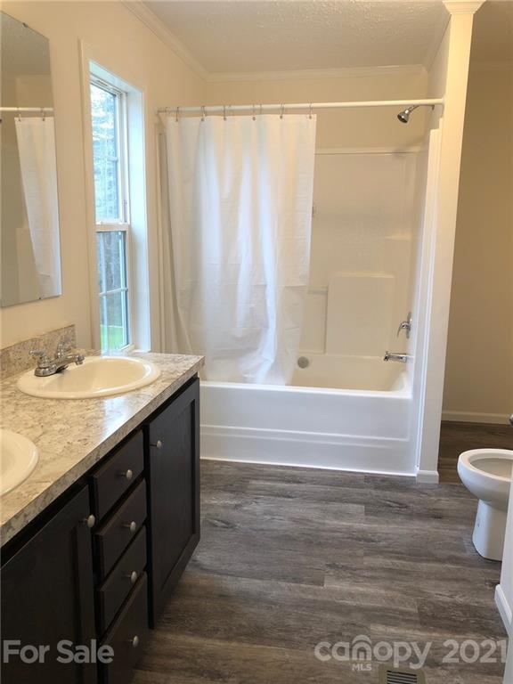 318 Souther Road Fletcher, NC 28732 - Photo 15 of 19 a bathroom with a granite countertop sink toilet and shower