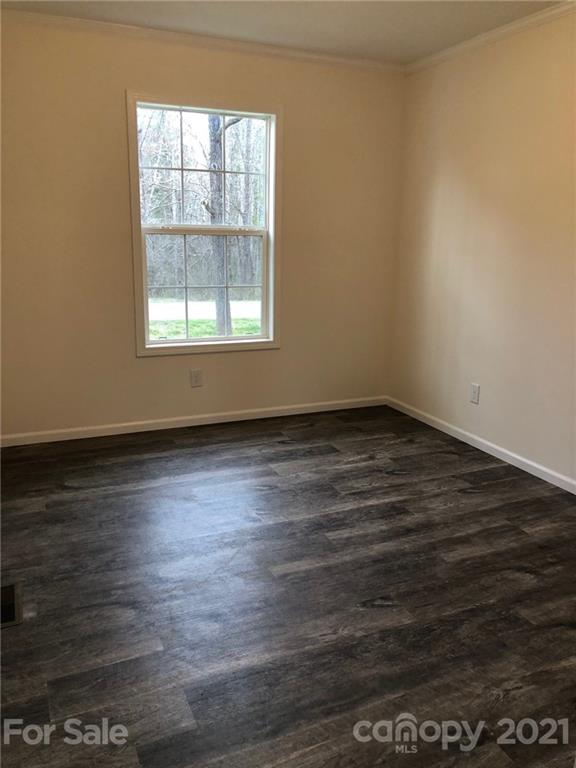 318 Souther Road Fletcher, NC 28732 - Photo 17 of 19 an empty room with wooden floor and windows