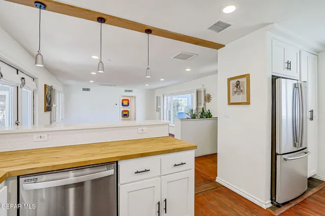 a view of a room that has a bed and a chair