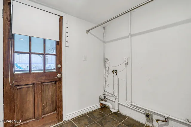 a bedroom with a bed and a potted plant