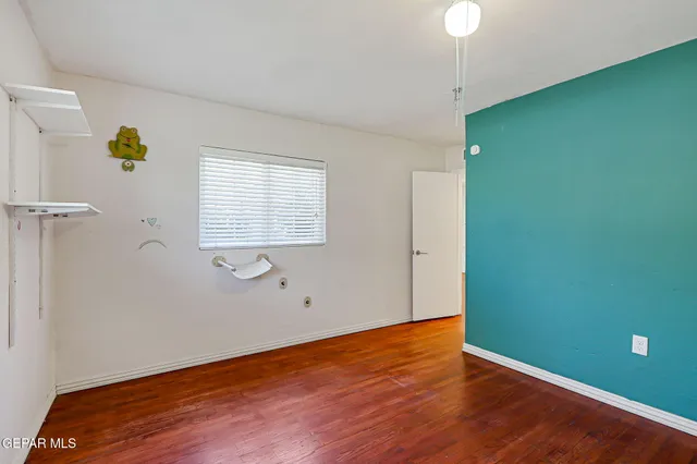 a bathroom with a toilet a sink and a mirror