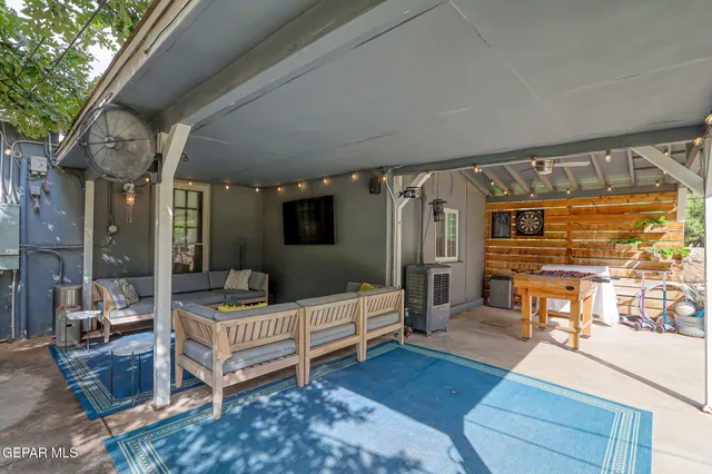 an aerial view of a house with a yard basket ball court and outdoor seating