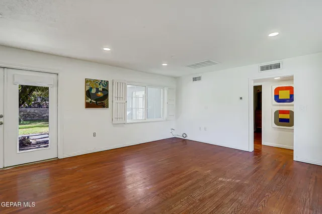 a view of kitchen with cabinets and wooden floor