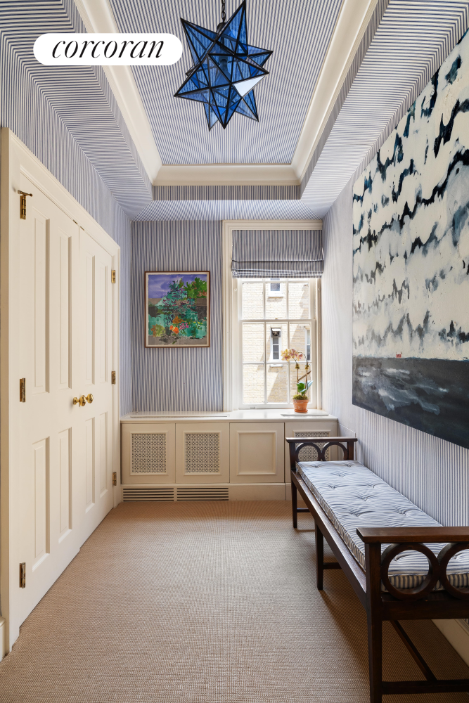 137 East 66th Street, Unit 8AB Manhattan, NY 10065 - Photo 12 of 18 a living room with furniture and a chandelier