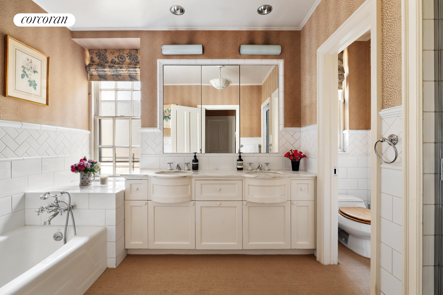 137 East 66th Street, Unit 8AB Manhattan, NY 10065 - Photo 13 of 18 a bathroom with a double vanity sink mirror and toilet