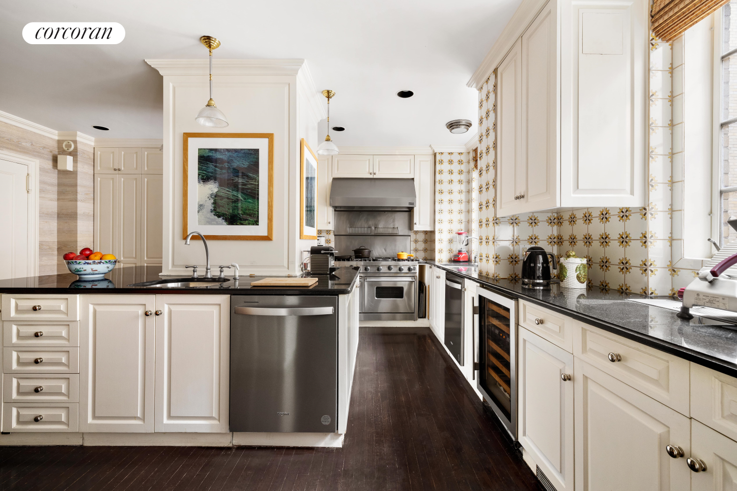 137 East 66th Street, Unit 8AB Manhattan, NY 10065 - Photo 9 of 18 a kitchen with stainless steel appliances a sink stove and cabinets