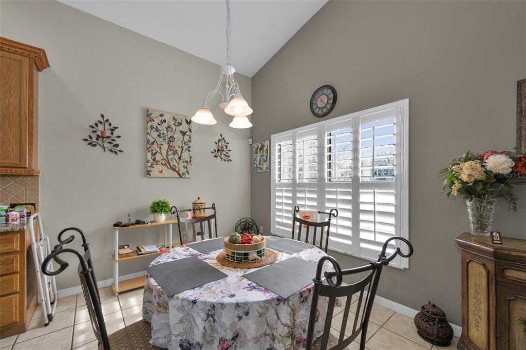 9630 Green Needle Drive New Port Richey, FL 34655 - Photo 20 of 83 a view of a dining room with furniture window and outside view