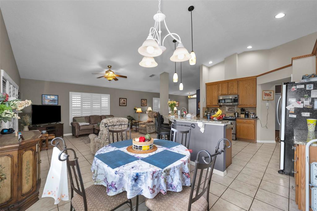 9630 Green Needle Drive New Port Richey, FL 34655 - Photo 22 of 83 a view of a dining room with furniture