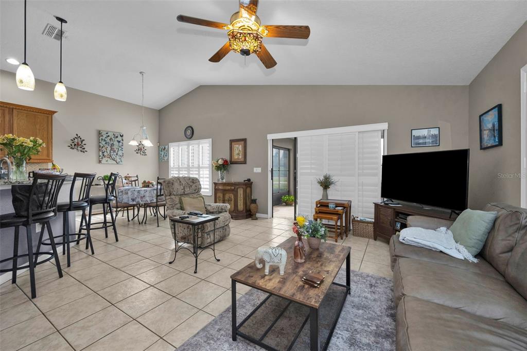 9630 Green Needle Drive New Port Richey, FL 34655 - Photo 23 of 83 a living room with furniture and a flat screen tv