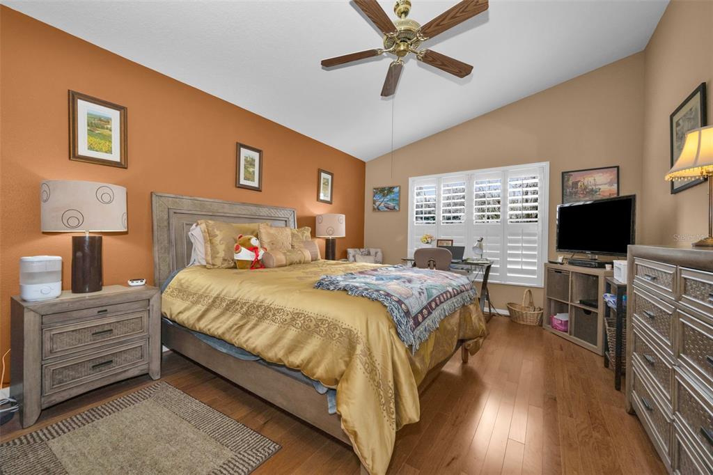 9630 Green Needle Drive New Port Richey, FL 34655 - Photo 26 of 83 a bedroom with a bed and a flat screen tv
