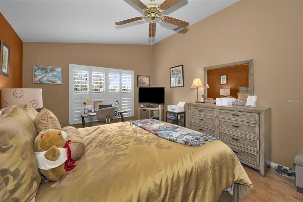 9630 Green Needle Drive New Port Richey, FL 34655 - Photo 27 of 83 a bed room with a bed and a television
