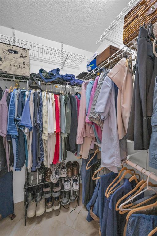 9630 Green Needle Drive New Port Richey, FL 34655 - Photo 31 of 83 a view of walk in closet with clothes