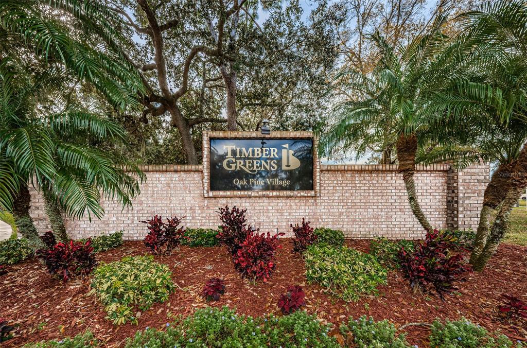 9630 Green Needle Drive New Port Richey, FL 34655 - Photo 53 of 83 a sign that is sitting in front of a tree