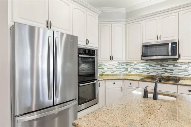 a view of a balcony with chairs and wooden floor