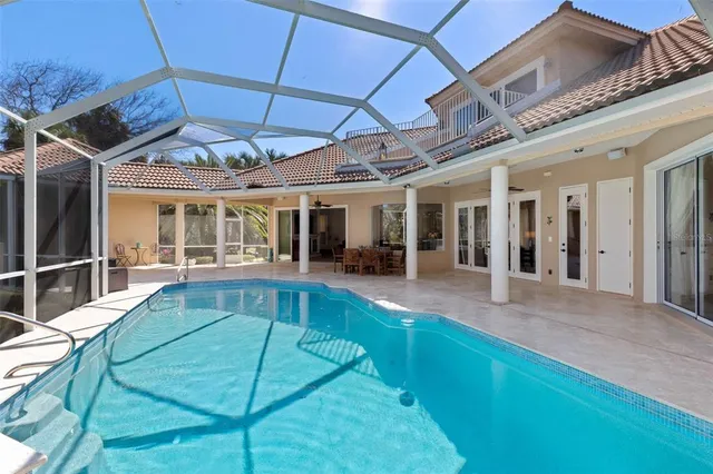 a spacious bedroom with a bed and cabinet
