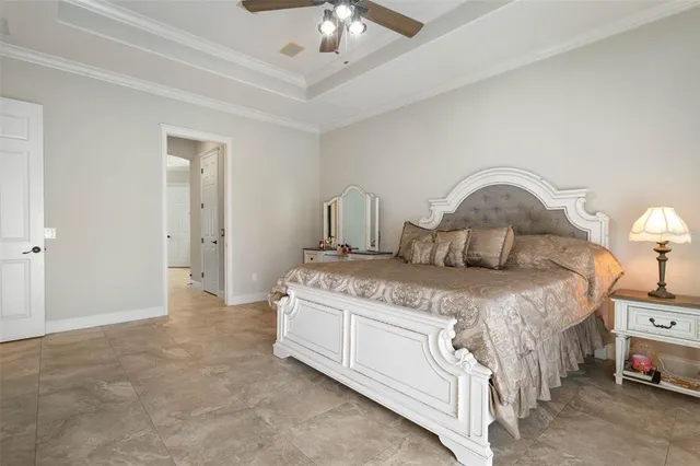 a dining room with furniture and a floor to ceiling window