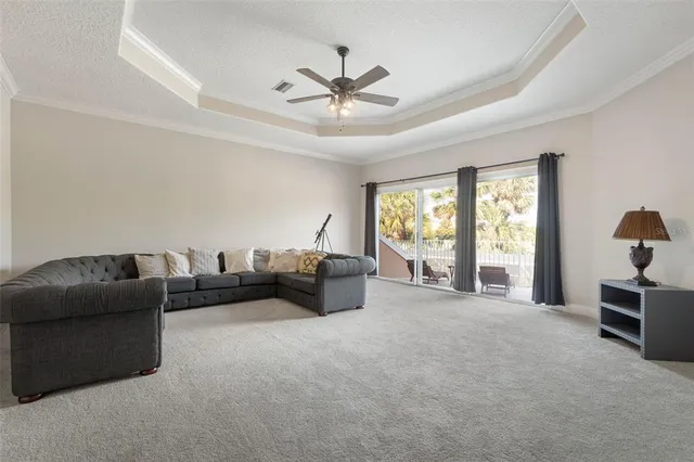 an aerial view of residential houses with outdoor space and ocean view