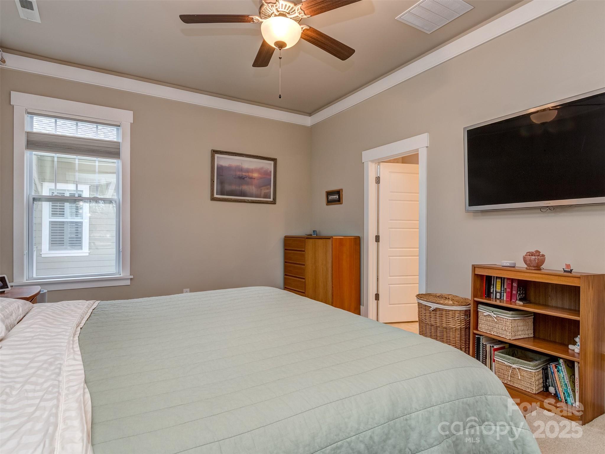 1055 Ridge Runner Road Rock Hill, SC 29730 - Photo 14 of 43 a bedroom with a bed and a flat screen tv