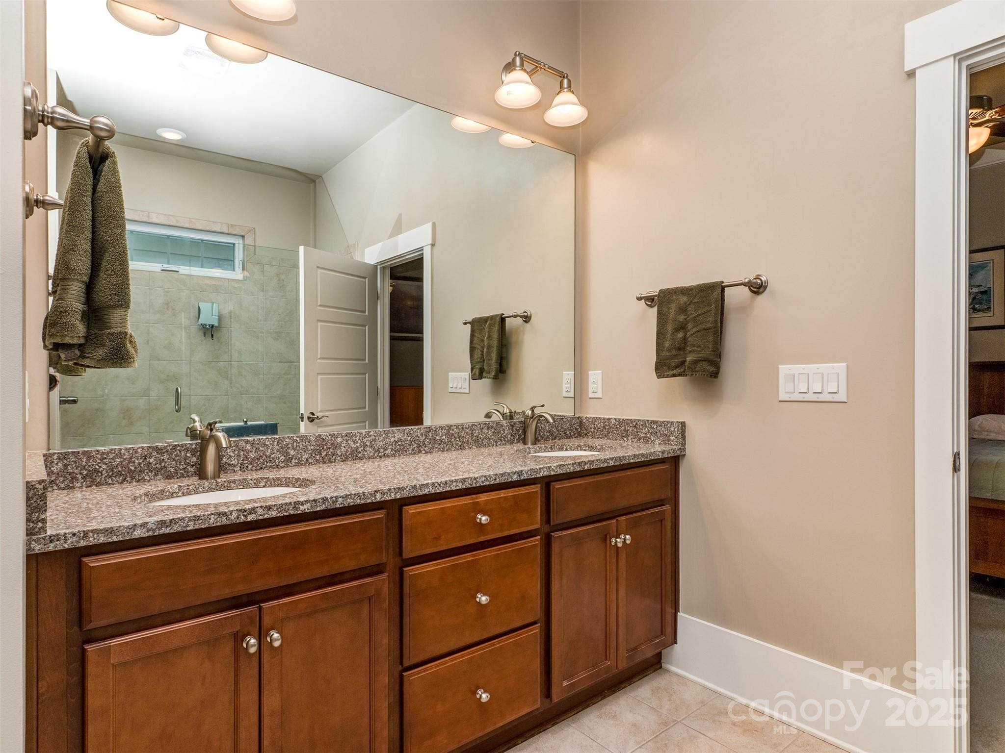 1055 Ridge Runner Road Rock Hill, SC 29730 - Photo 15 of 43 a bathroom with a granite countertop double vanity sink and a mirror