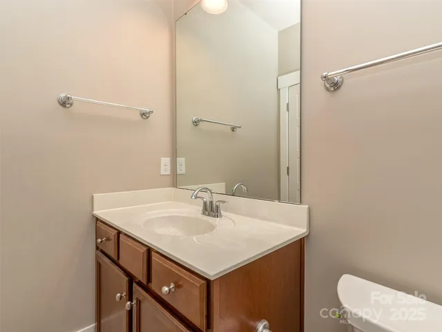a bathroom with a sink and mirror