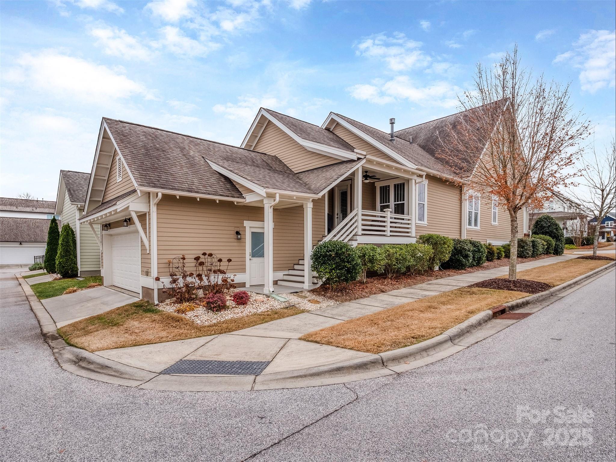 1055 Ridge Runner Road Rock Hill, SC 29730 - Photo 28 of 43 a view of a white house with a chairs in patio