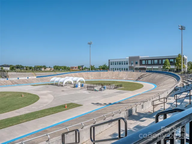a view of a swimming pool with furniture