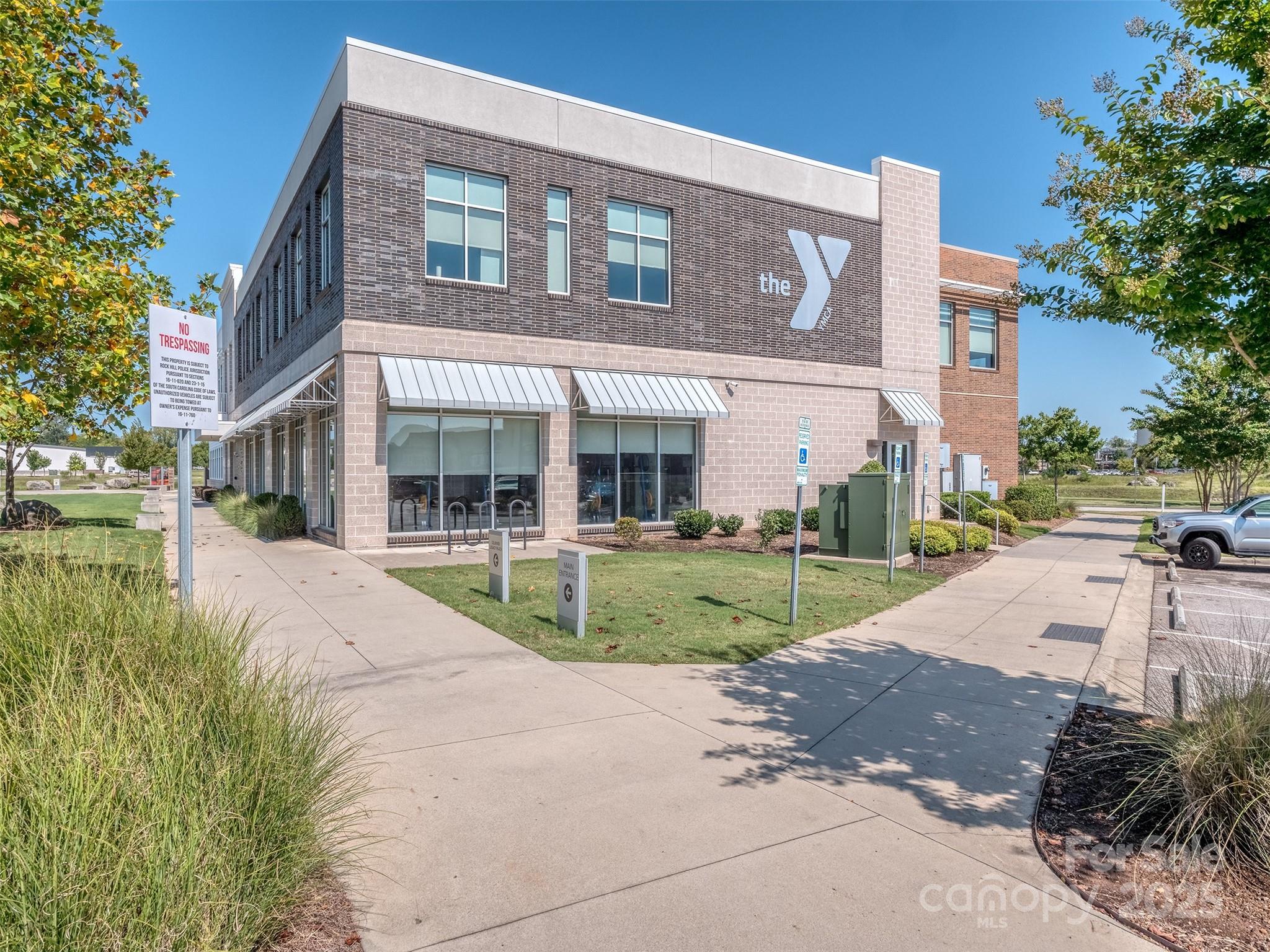 1055 Ridge Runner Road Rock Hill, SC 29730 - Photo 32 of 43 a view of a brick building next to a yard