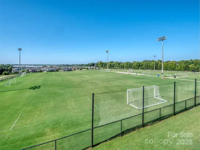 a view of a park with swings and slides
