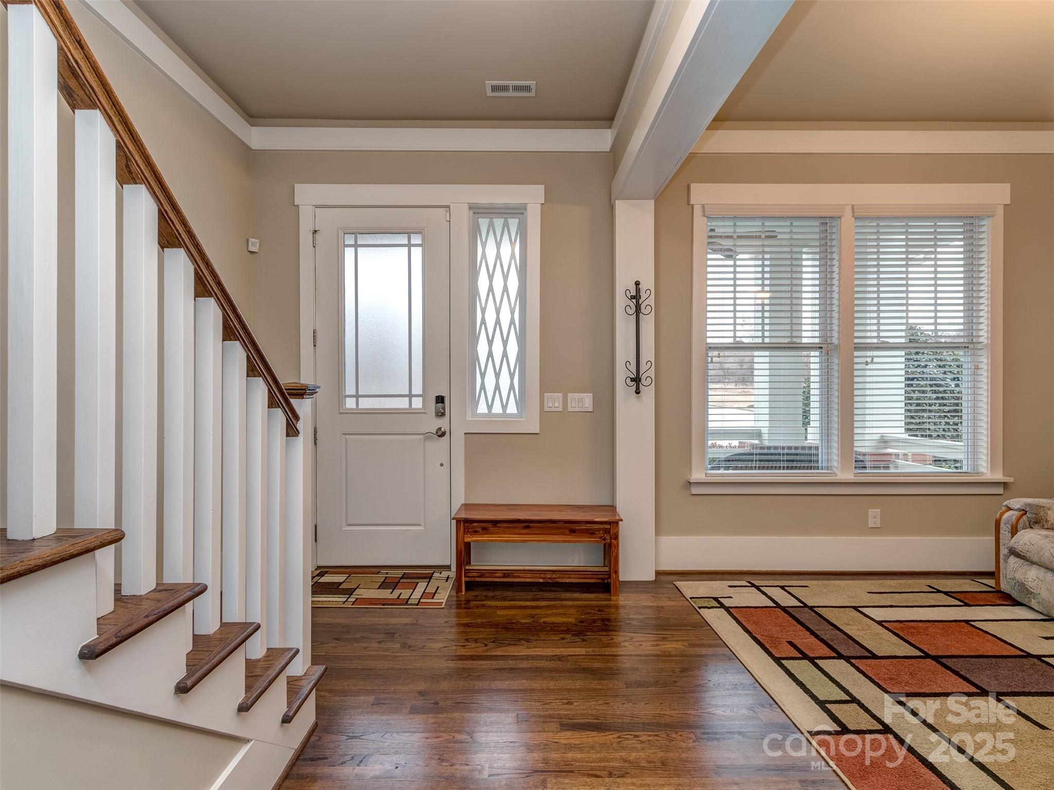 1055 Ridge Runner Road Rock Hill, SC 29730 - Photo 4 of 43 a view of an entryway with wooden floor and stairs