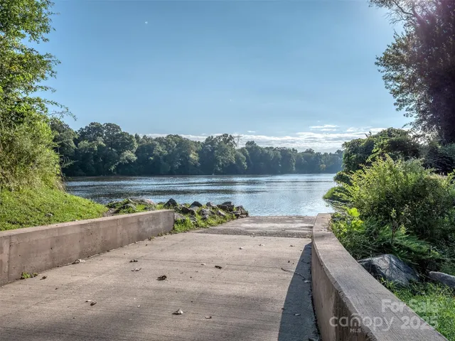 a view of a chair and table on the garden