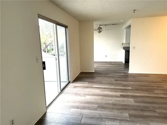 a view of a hallway view with wooden floor and staircase