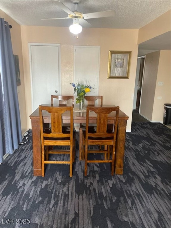 4150 Solteros Street, Unit 1 Las Vegas, NV 89103 - Photo 11 of 25 Dining area featuring dark colored carpet, a textured ceiling, and a ceiling fan