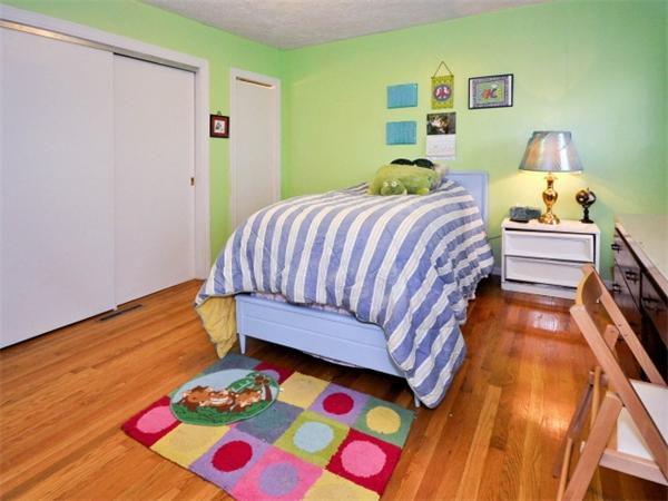 14 Beach Street, Unit 14 Newton, MA 02458 - Photo 11 of 15 a bedroom with a bed and wooden floor