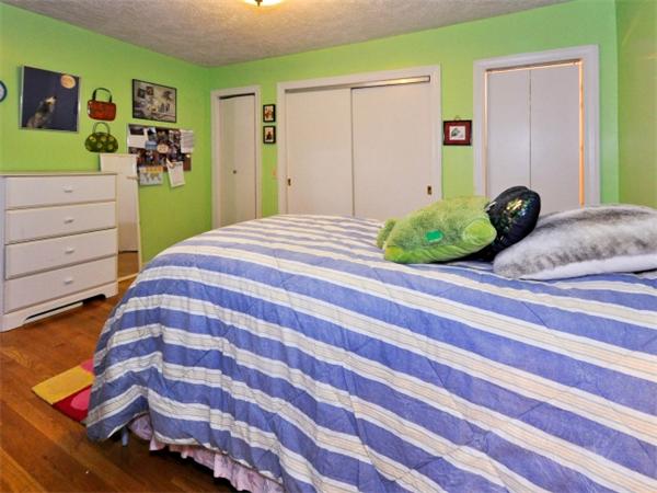 14 Beach Street, Unit 14 Newton, MA 02458 - Photo 12 of 15 a bedroom with a bed and cabinets