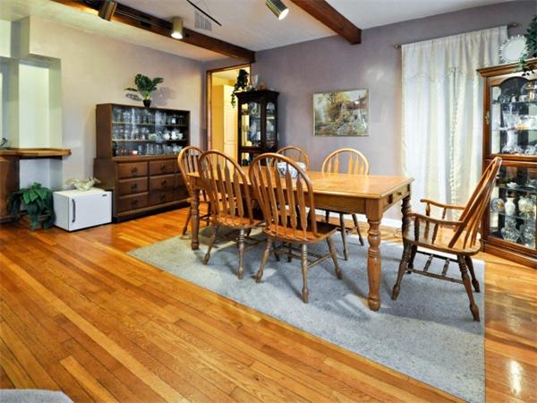 14 Beach Street, Unit 14 Newton, MA 02458 - Photo 3 of 15 a view of a dining room with furniture and chandelier