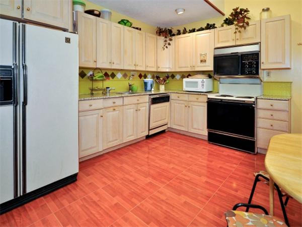 14 Beach Street, Unit 14 Newton, MA 02458 - Photo 5 of 15 a kitchen with a sink appliances and cabinets