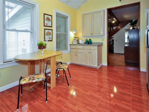 14 Beach Street, Unit 14 Newton, MA 02458 - Photo 6 of 15 a view of a dining room with furniture and wooden floor