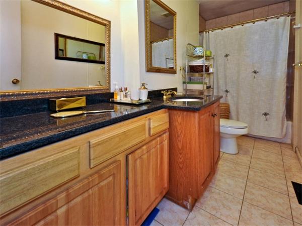 14 Beach Street, Unit 14 Newton, MA 02458 - Photo 8 of 15 a bathroom with a sink a toilet and shower