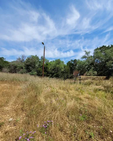 a view of a lake with a yard