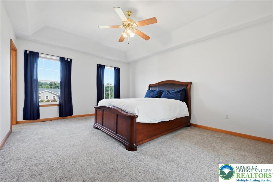 66 Labar Road Bangor, PA 18013 - Photo 23 of 56 A spacious bedroom presents a welcoming ambiance with a classic wooden bed frame and soft carpeting.