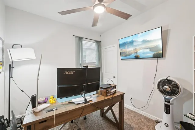 a view of a workspace with furniture