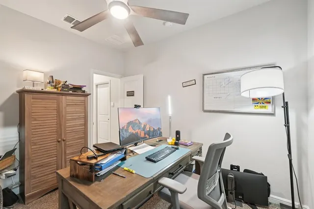 a bedroom with a bed couch and a window