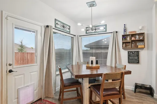 a dining room with furniture and window
