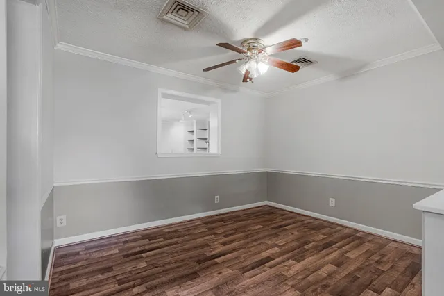 a view of a room with wooden floor and closet