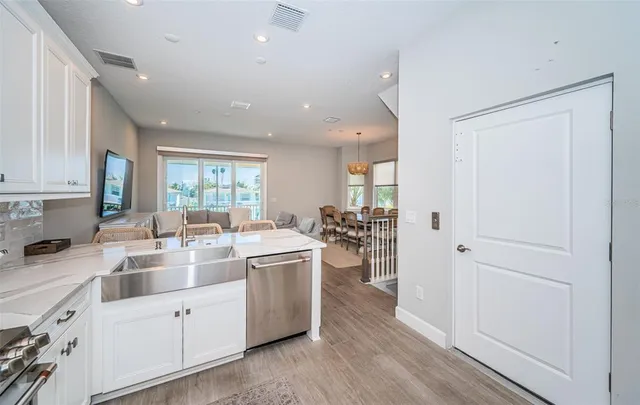 a kitchen with sink and cabinets