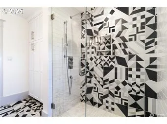 a bathroom with a black white checkered floor