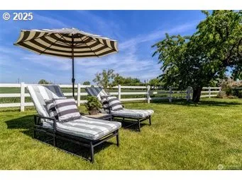 a view of a backyard with sitting area