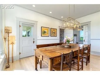 a dining room with a table and chairs