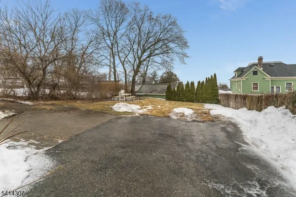 a view of a chairs and table in a patio